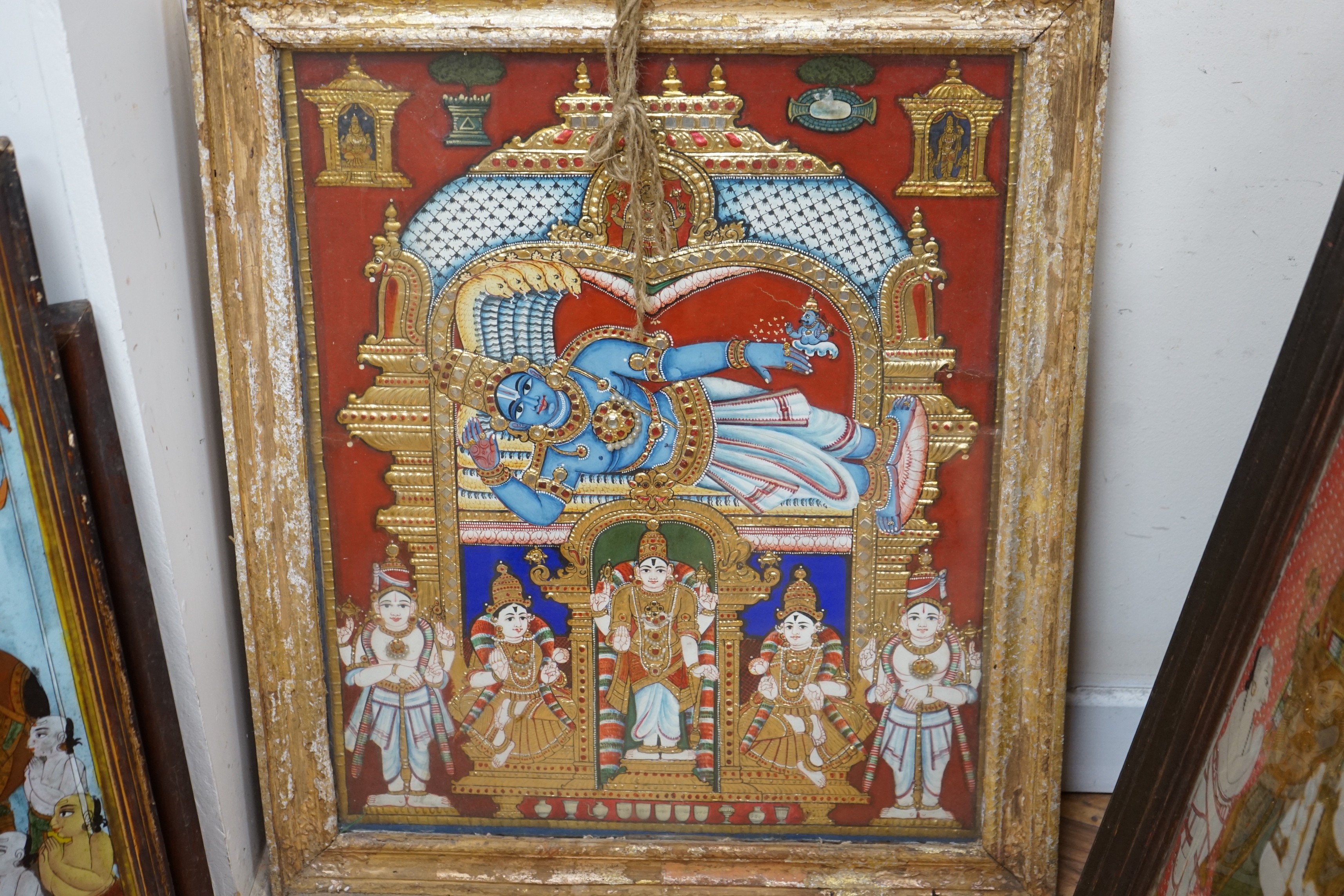 A collection of eight Indian reverse decorated glass pictures, 20th century, largest frame 70cm X 60cm